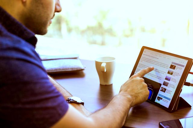 browsing website content on laptop